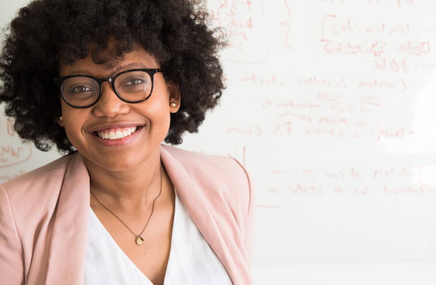 Woman Standing by Whiteboard